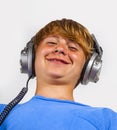 Cute handsome boy listening to music by headphones Royalty Free Stock Photo