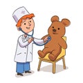 Cute handsome little boy doctor listening teddy bear heart beat with stethoscope. Cheerful smiling child playing with Royalty Free Stock Photo