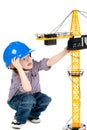 Little cute handsome little child playing a builder