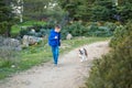 Cute handsome stylish boy enjoying colourful autumn park with his best friend red and white english bull dog.Delightfull