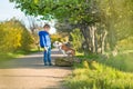 Cute handsome stylish boy enjoying colourful autumn park with his best friend red and white english bull dog.Delightfull