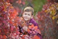 Cute handsome stylish boy enjoying colourful autumn park with his best friend red and white english bull dog.Delightfull Royalty Free Stock Photo