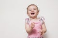 Cute happy baby is laughing fearless. looking in to camera. Royalty Free Stock Photo