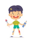 Cute happy boy artist holding paint brush and pencil to draw and create art pictures