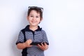 Cute happy boy using mobile phone. Child playing on smartphone. Royalty Free Stock Photo