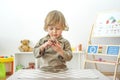 Cute happy child boy having fun eating chocolate cake at home. Chocolate, sweets and sugar, unhealthy food for children conceptual Royalty Free Stock Photo