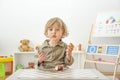 Cute happy child boy having fun eating chocolate cake at home. Chocolate, sweets and sugar, unhealthy food for children conceptual Royalty Free Stock Photo