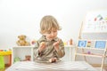 Cute happy child boy having fun eating chocolate cake at home. Chocolate, sweets and sugar, unhealthy food for children conceptual Royalty Free Stock Photo