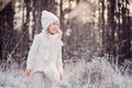 Cute happy child girl portrait on the walk in winter snowy forest