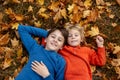 Cute happy children, siblings, boys, playing with knitted toys in the park, autumntime Royalty Free Stock Photo