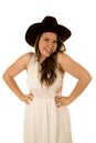 Cute happy cowgirl with her hands on her hips smiling Royalty Free Stock Photo