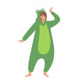 Cute happy girl in frog kigurumi costume on pajama party or sleepover