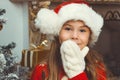 Cute happy girl in red hat sitting and smilling Royalty Free Stock Photo