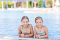 Cute happy girls at the pool