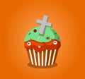 Cute happy halloween cupcake with grave cross and monster eyes