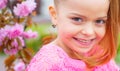 Cute happy joyful girl with long hair close up. Springtime. Childhood. Funny holliday. Cute child having fun on a sunny Royalty Free Stock Photo