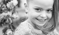 Cute happy joyful girl with long hair close up. Springtime. Childhood. Funny holliday. Cute child having fun on a sunny Royalty Free Stock Photo