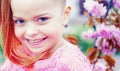 Cute happy joyful girl with long hair close up. Springtime. Childhood. Funny holliday. Cute child having fun on a sunny Royalty Free Stock Photo