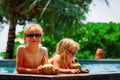 Cute happy kids -boy and girl- drinking coconut cocktail on beach resort Royalty Free Stock Photo