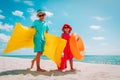 Cute happy kids, boy and girl, go swim and play on beach Royalty Free Stock Photo