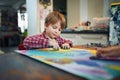 Cute happy little boy, adorable preschooler, painting in a sunny art studio. Young artist at work Royalty Free Stock Photo