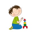 Cute happy little boy is kneeling on the floor, building bricks