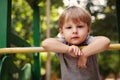 Cute happy little boy leaning on a railing Royalty Free Stock Photo