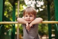 Cute happy little boy leaning on a railing Royalty Free Stock Photo