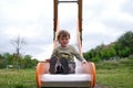 Cute happy little boy playing on slide in Playground Royalty Free Stock Photo