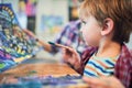 Cute happy little boy and teacher drawing in artist class. Education concept. Nursery and Preschool theme Royalty Free Stock Photo