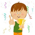 Cute happy little boy wearing sports wear holding a gold cup trophy showing victory sign Royalty Free Stock Photo