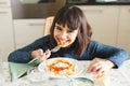 Happy little girl eating pasta Royalty Free Stock Photo