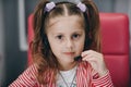 Little cute child girl wearing headphones. Preschool girl or kid listening to music isolated on gray background. Melody Royalty Free Stock Photo