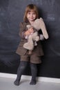 Cute Happy little girl hugging her toy rabbit Royalty Free Stock Photo