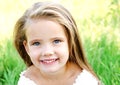 Cute happy little girl on the meadow Royalty Free Stock Photo