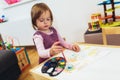 Cute happy little girl, preschooler, painting with water color Royalty Free Stock Photo