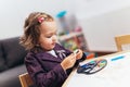 Happy little girl, preschooler, painting with water color, selective focus Royalty Free Stock Photo