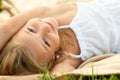 Cute happy little girl in white dress lying Royalty Free Stock Photo