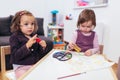 Happy little girls, preschooler, painting with water color, selective focus Royalty Free Stock Photo