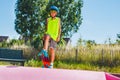 Cute happy skater boy do tricks in the skating park Royalty Free Stock Photo