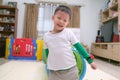 Cute happy smiling Asian little boy playing and having fun inside toy tunnel tube indoor at home Royalty Free Stock Photo