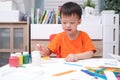 Asian 3 years old toddler boy enjoy using glue doing arts at home, Fun paper and glue crafts for toddlers, Children`s Art Project