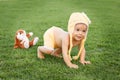 Cute happy smiling little baby girl in yellow clothing and funny