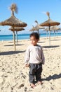 Cute boy playing with small ball on beach on Mallorca Royalty Free Stock Photo