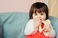 Cute happy 1 year old baby girl playing with wooden toys at home Royalty Free Stock Photo