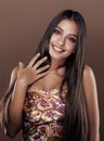 Cute happy young indian woman in studio close up