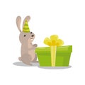 Cute hare in party hat with big green gift box cartoon vector Illustration Royalty Free Stock Photo