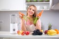 Cute healthy girl with fruits and vegetables