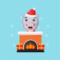 Cute hippo on the Christmas Chimney Fireplace Royalty Free Stock Photo