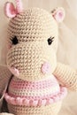 Cute Hippopotamus crochet in vintage background. Toy for kids. Hippo knitting. Handmade. Hippie soft toy Cute woolen. Hippie baby